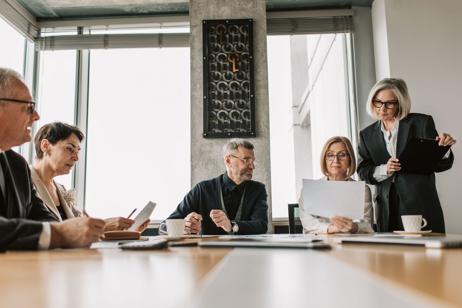 The boardroom is where the travel policy is written; the account is where it is kept